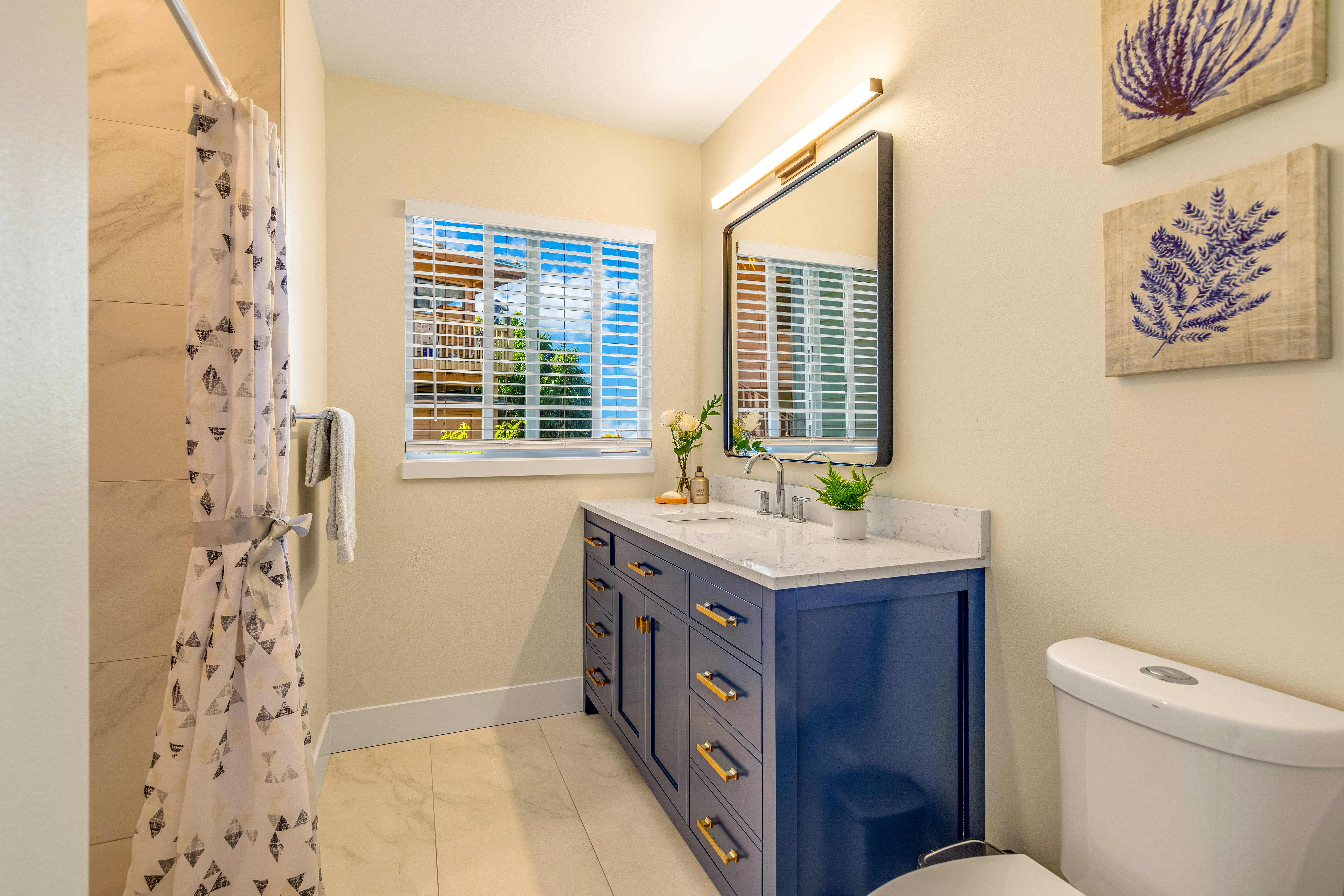 77-6472 Kilohana Street Kailua-Kona, HI 96740 - Photo 14 of 29 a bathroom with a granite countertop sink toilet and shower