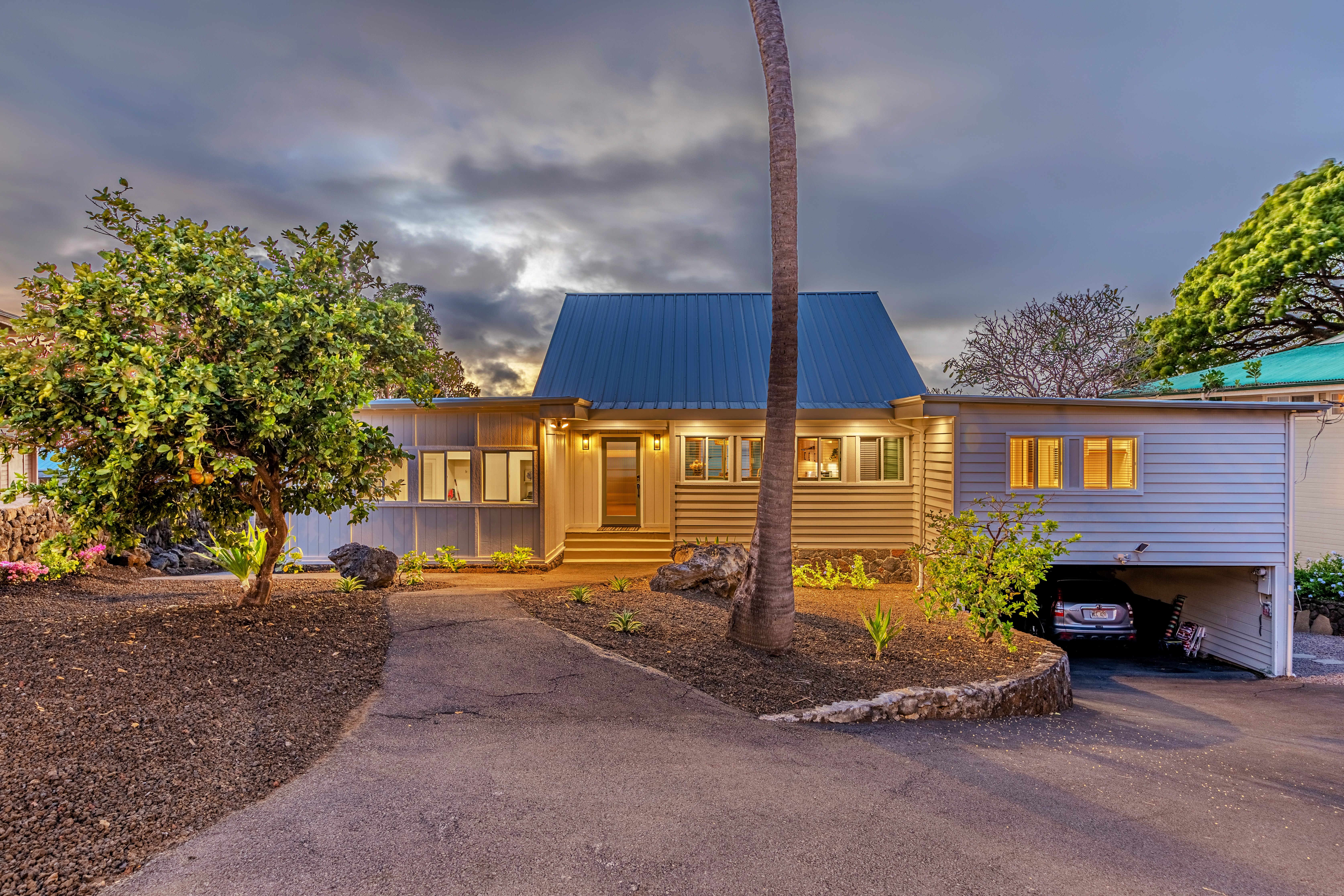 77-6472 Kilohana Street Kailua-Kona, HI 96740 - Photo 2 of 29 a front view of a house with a yard