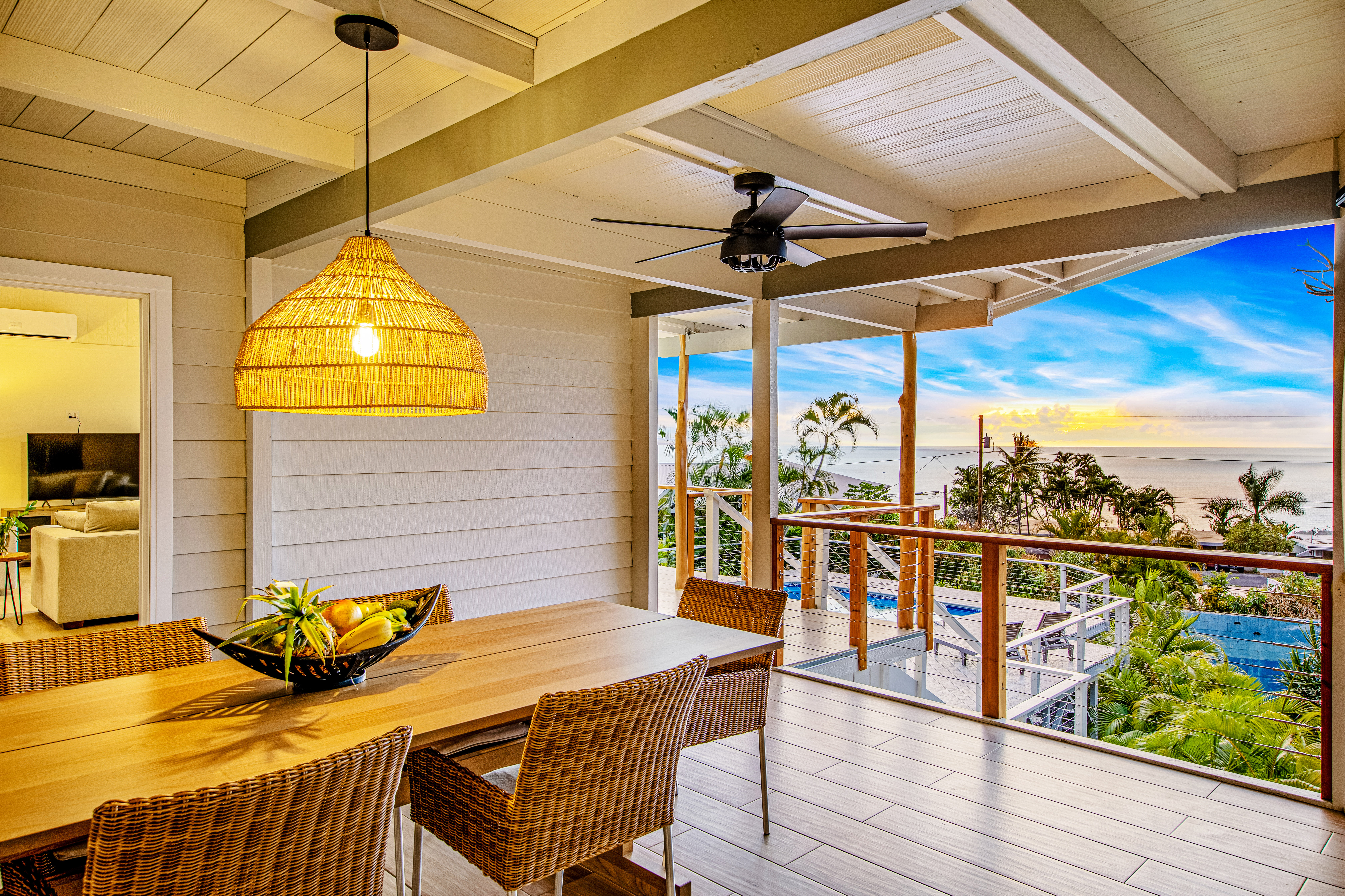 77-6472 Kilohana Street Kailua-Kona, HI 96740 - Photo 25 of 29 a view of a balcony dining area with furniture and wooden floor