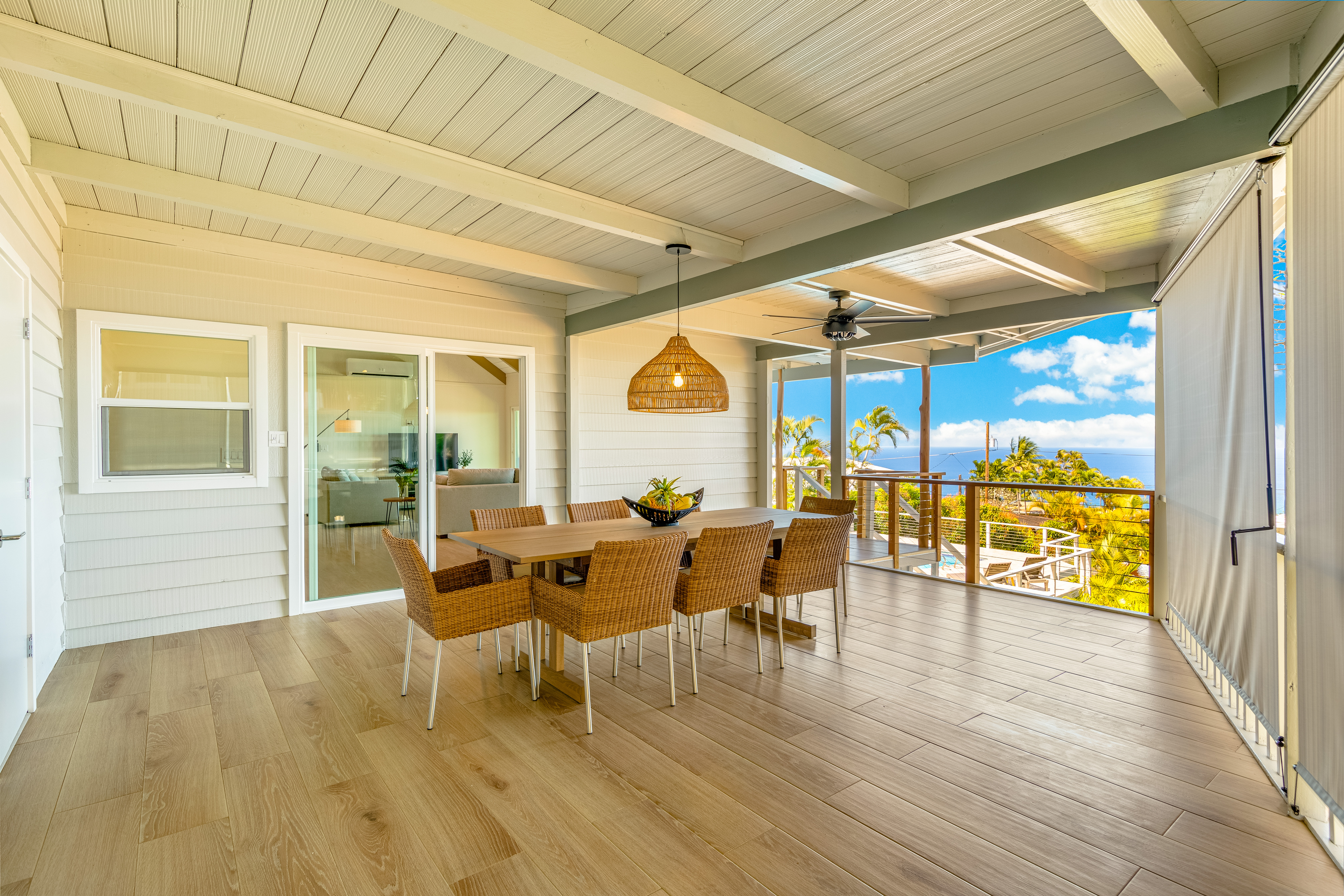 77-6472 Kilohana Street Kailua-Kona, HI 96740 - Photo 5 of 29 a dining room with wooden floor glass table and glass door