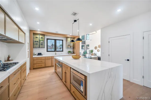 a kitchen with a stove and a sink