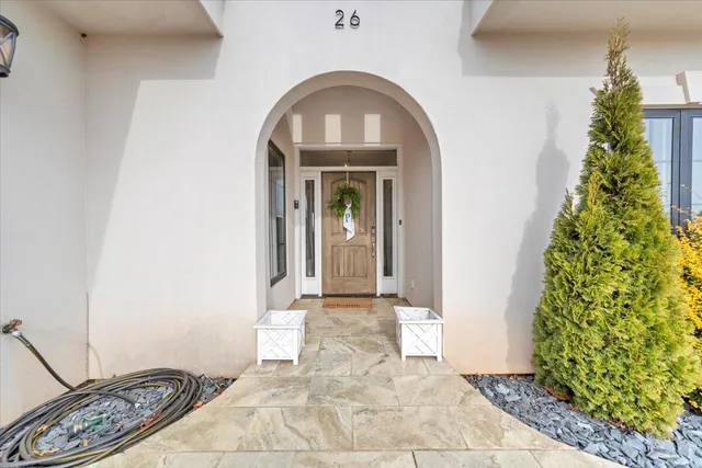 a living room with furniture or kitchen view and a wooden floor