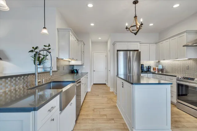 a spacious bathroom with a bathtub shower sink mirror and toilet