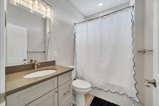 a view of a house with a yard and lake view