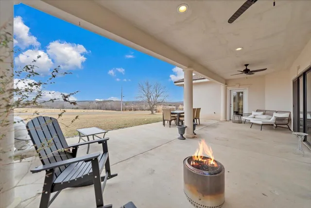 a big house with a big yard and large trees