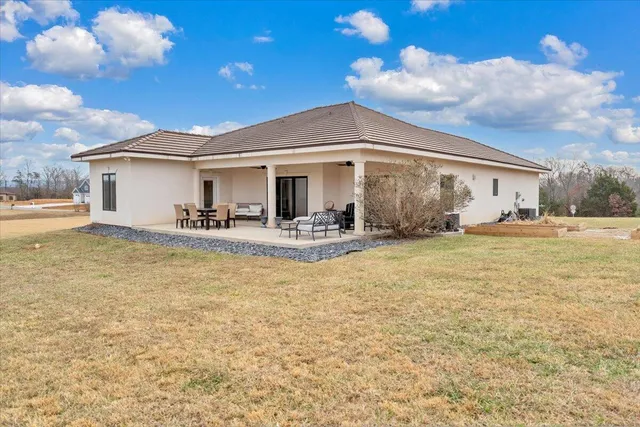 a front view of a multi story residential apartment building with a yard