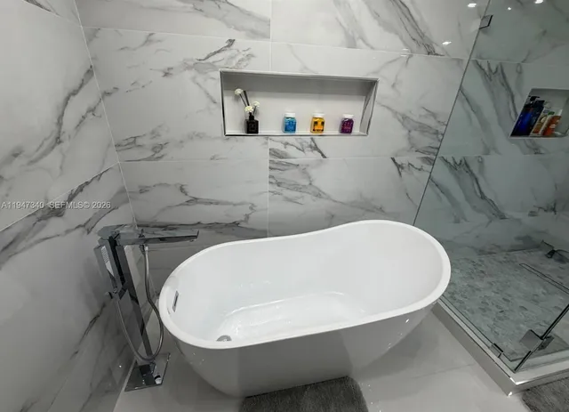 a view of balcony with wooden floor and potted plants
