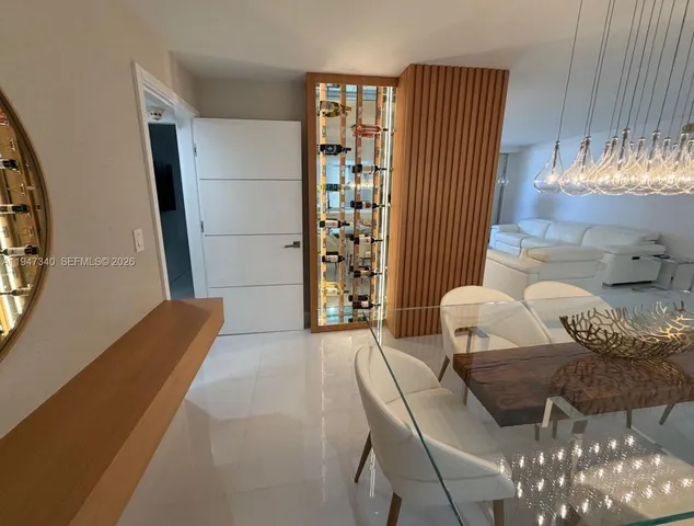 a bedroom with a bed and a television