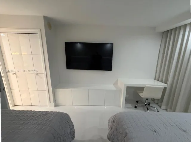 a dining room with furniture and a chandelier