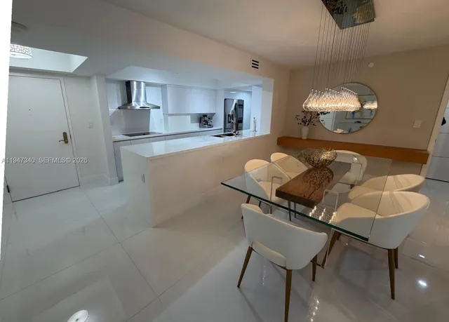 a bathroom with a sink mirror vanity and toilet