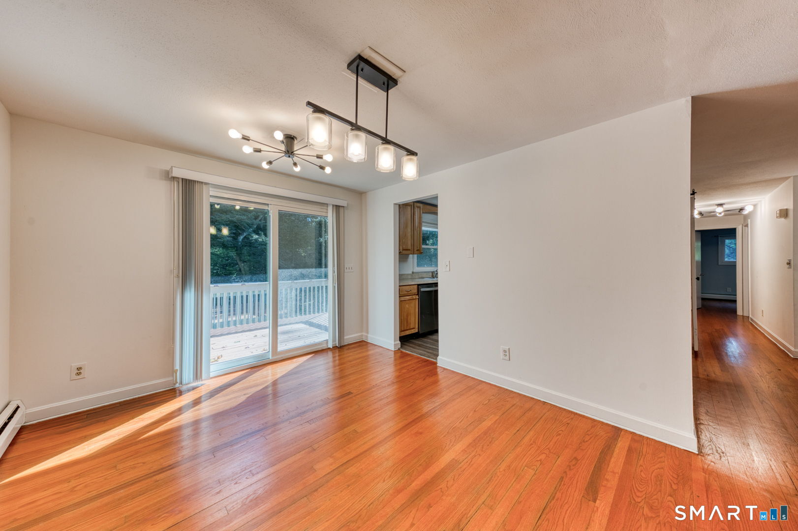 16 Westgate Lane Mansfield, CT 06268 - Photo 16 of 40 a view of empty room with wooden floor and fan