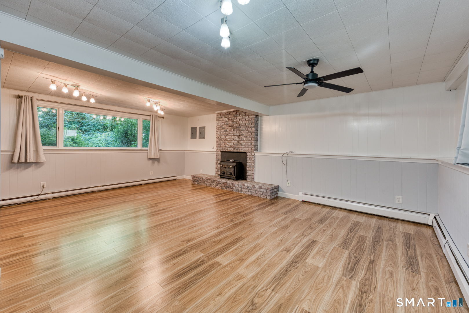 16 Westgate Lane Mansfield, CT 06268 - Photo 27 of 40 a view of empty room with wooden floor and fan