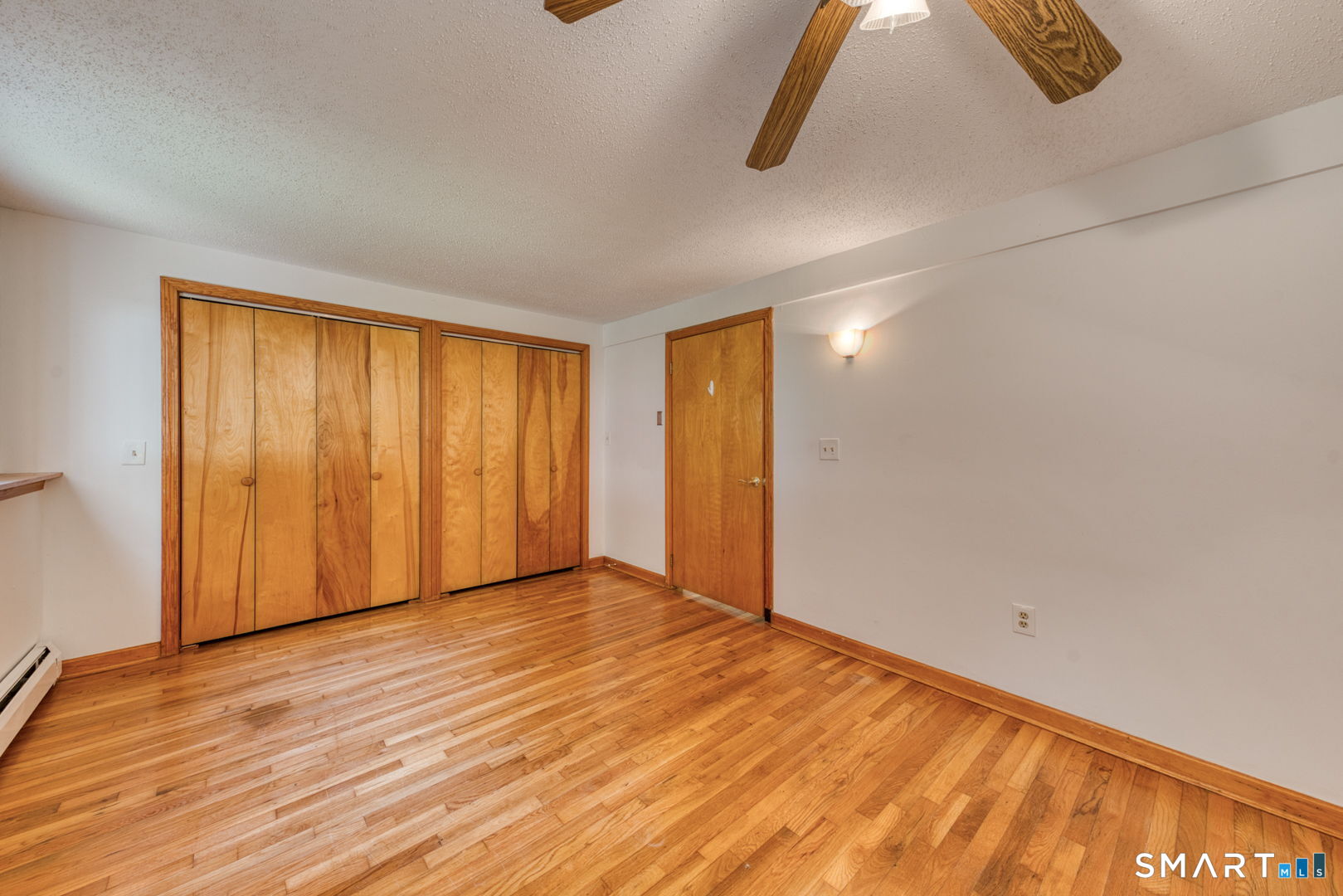 16 Westgate Lane Mansfield, CT 06268 - Photo 34 of 40 a view of an empty room with wooden floor