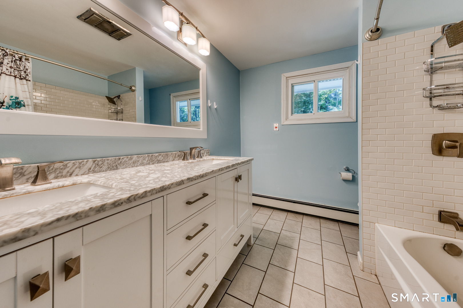16 Westgate Lane Mansfield, CT 06268 - Photo 38 of 40 a spacious bathroom with a granite countertop sink a mirror and a bathtub