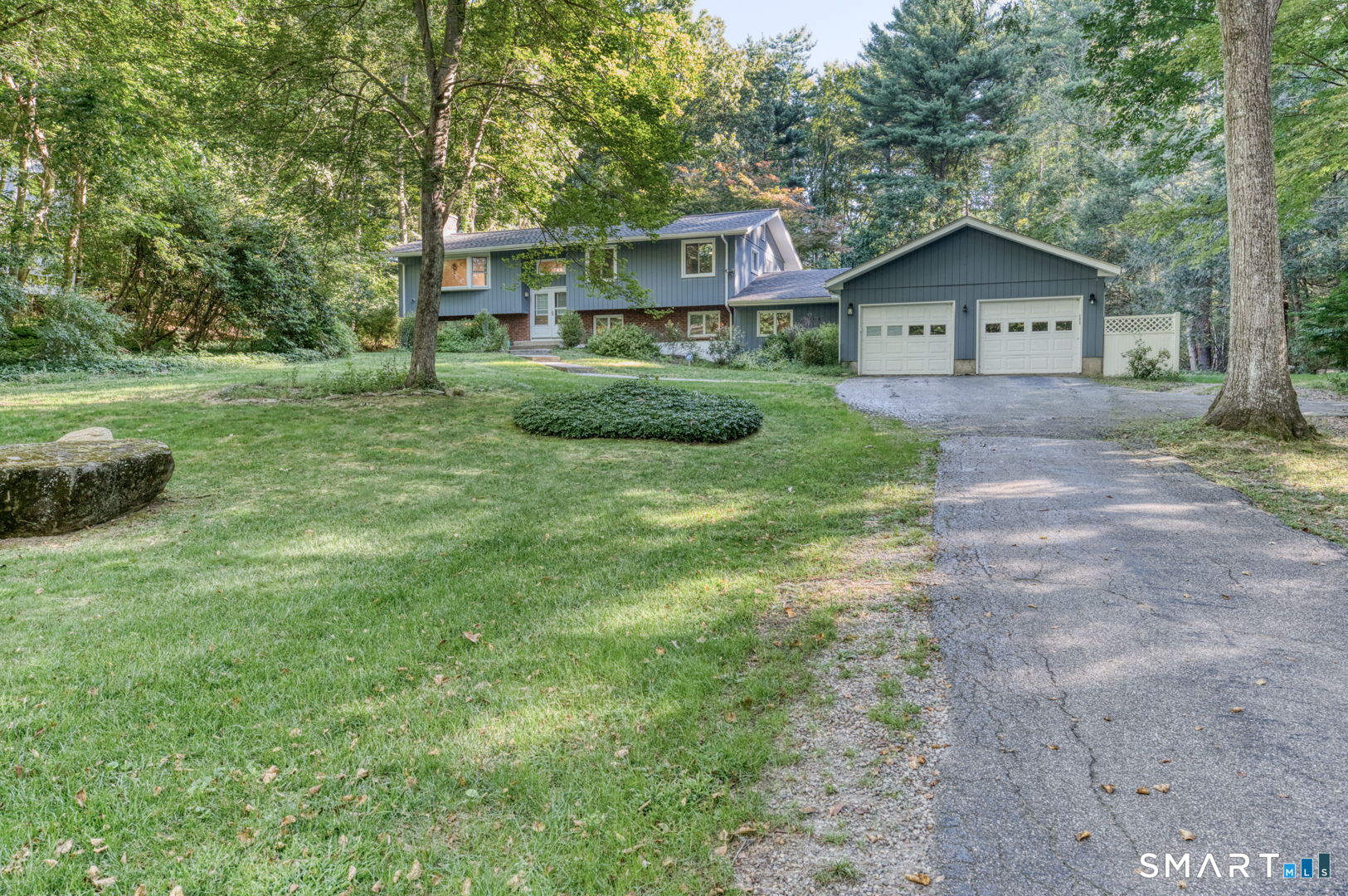 16 Westgate Lane Mansfield, CT 06268 - Photo 40 of 40 a front view of a house with a yard and garage
