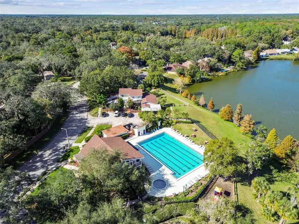 an aerial view of a house with a lake view