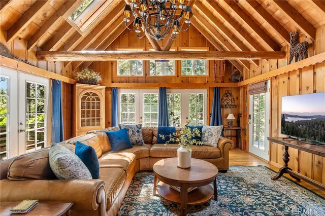 a living room with furniture a rug and a large window