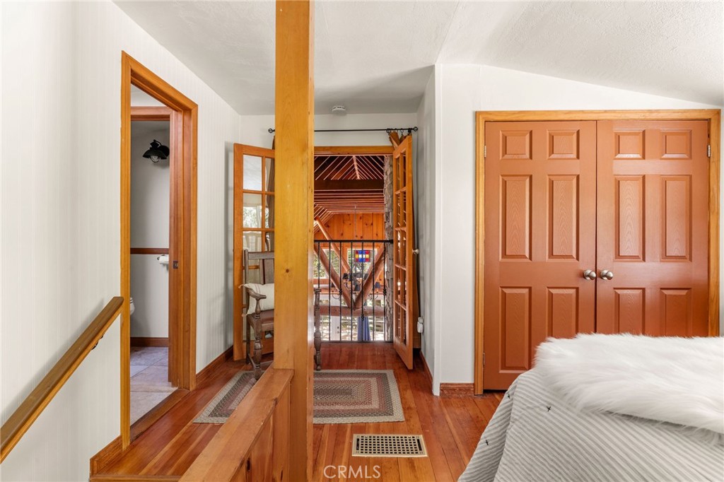 816 Fern Road Lake Arrowhead, CA 92385 - Photo 21 of 35 a bedroom with a bed and a window