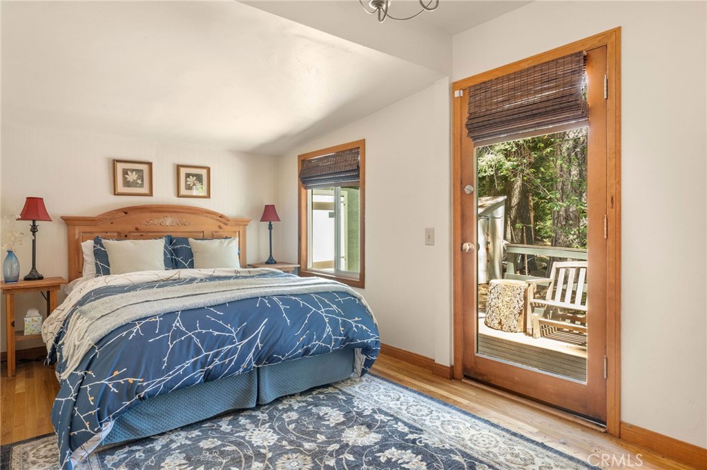 816 Fern Road Lake Arrowhead, CA 92385 - Photo 24 of 35 a bedroom with a bed and a window