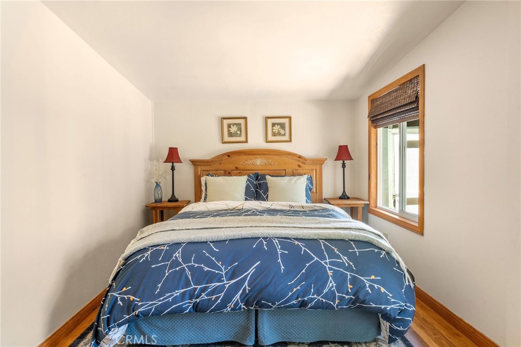 816 Fern Road Lake Arrowhead, CA 92385 - Photo 25 of 35 a bedroom with a bed and window