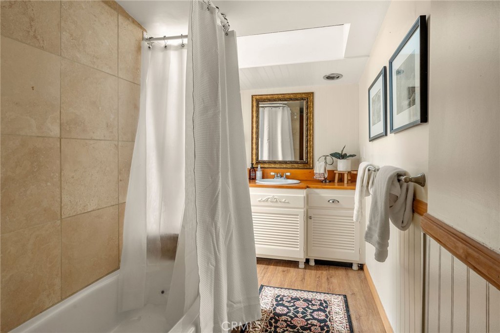 816 Fern Road Lake Arrowhead, CA 92385 - Photo 29 of 35 a bathroom with a sink a mirror and shower