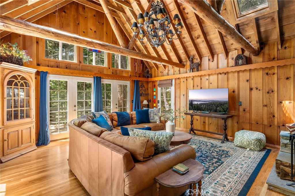 816 Fern Road Lake Arrowhead, CA 92385 - Photo 3 of 35 a living room with furniture and a flat screen tv