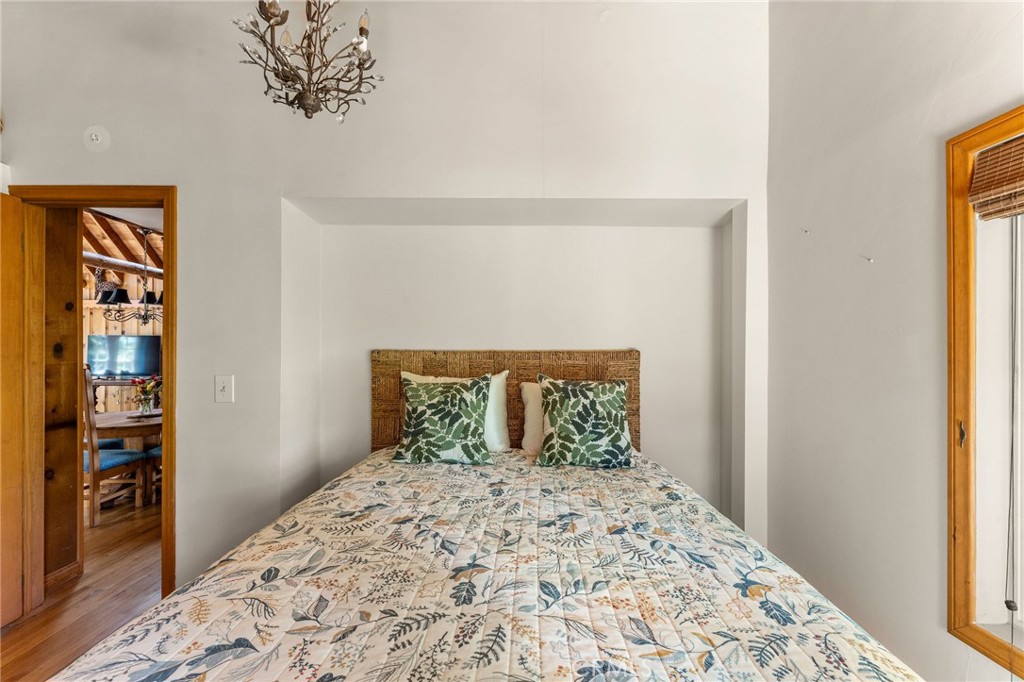 816 Fern Road Lake Arrowhead, CA 92385 - Photo 33 of 35 a bedroom with a large bed and a window