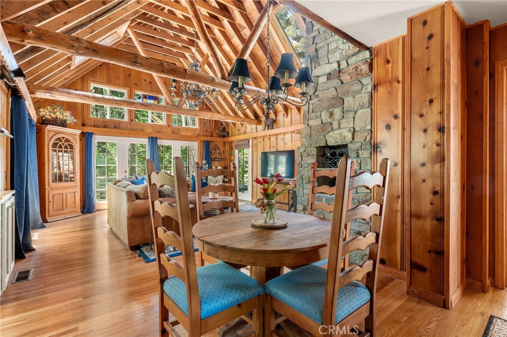 816 Fern Road Lake Arrowhead, CA 92385 - Photo 7 of 35 a view of a dining room with furniture and wooden floor