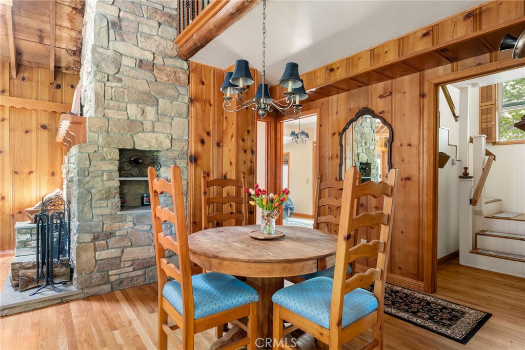 816 Fern Road Lake Arrowhead, CA 92385 - Photo 8 of 35 a view of a dining room with furniture and wooden floor