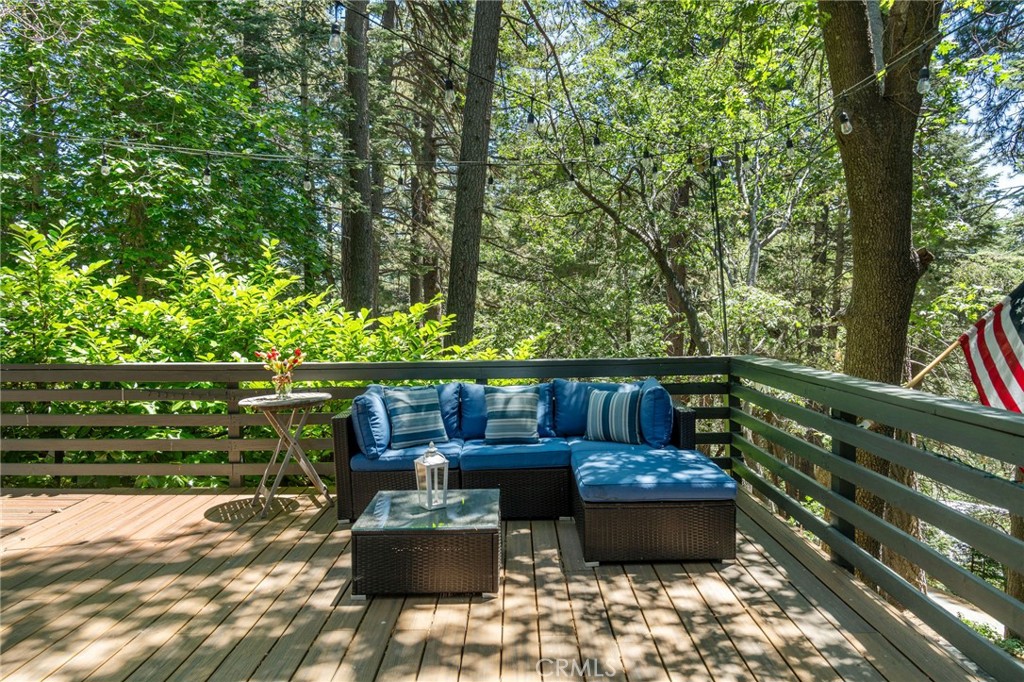 816 Fern Road Lake Arrowhead, CA 92385 - Photo 10 of 35 a view of a chairs and table in the backyard
