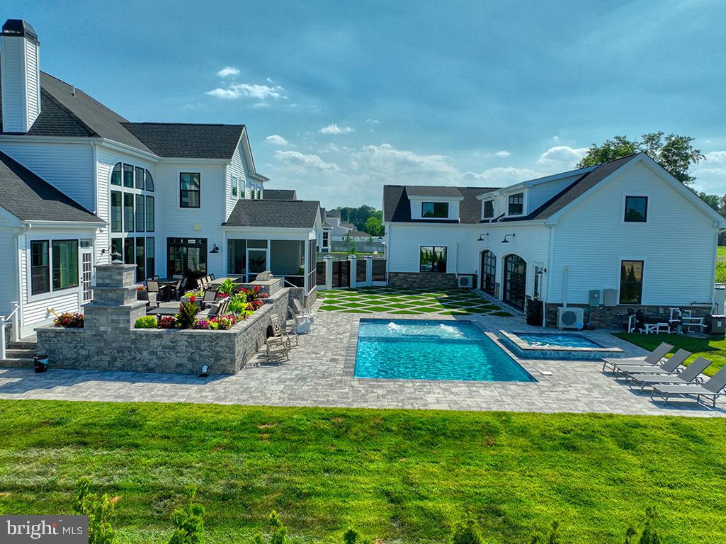16516 New Road Lewes, DE 19958 - Photo 16 of 109 a view of a house with backyard swimming pool and sitting area