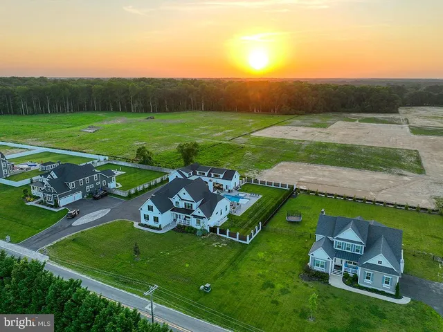 a view of swimming pool outdoor seating and city view