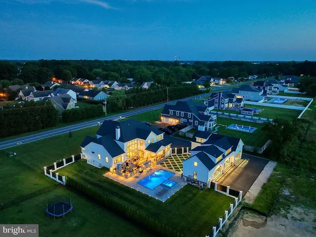 a living room with furniture or kitchen view and a large window