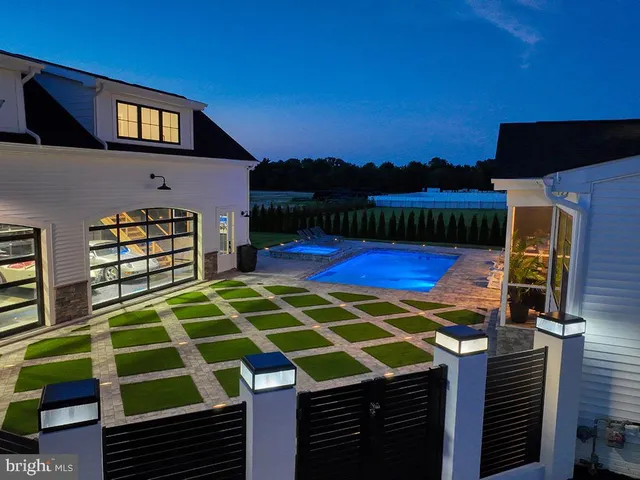 a large kitchen with a large counter top appliances and cabinets