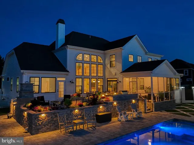 a kitchen with granite countertop white cabinets and stainless steel appliances