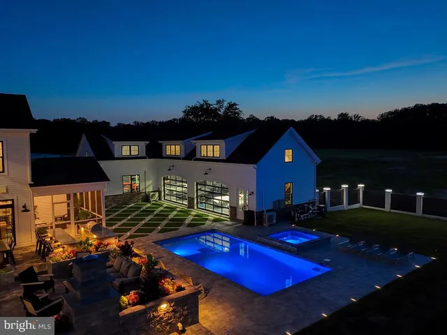 a room with pool table and windows