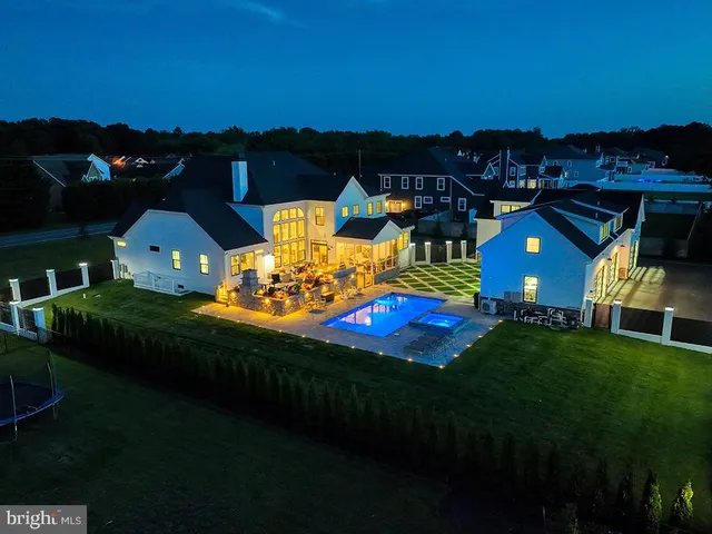 a white bath tub sitting in a bathroom next to a window