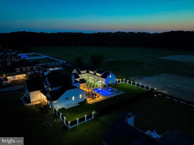a bedroom with a large bed and a large window