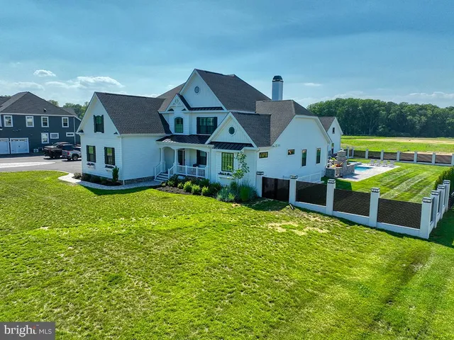 an aerial view of a house with garden