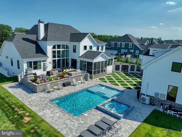 a front view of a house with a yard table and chairs