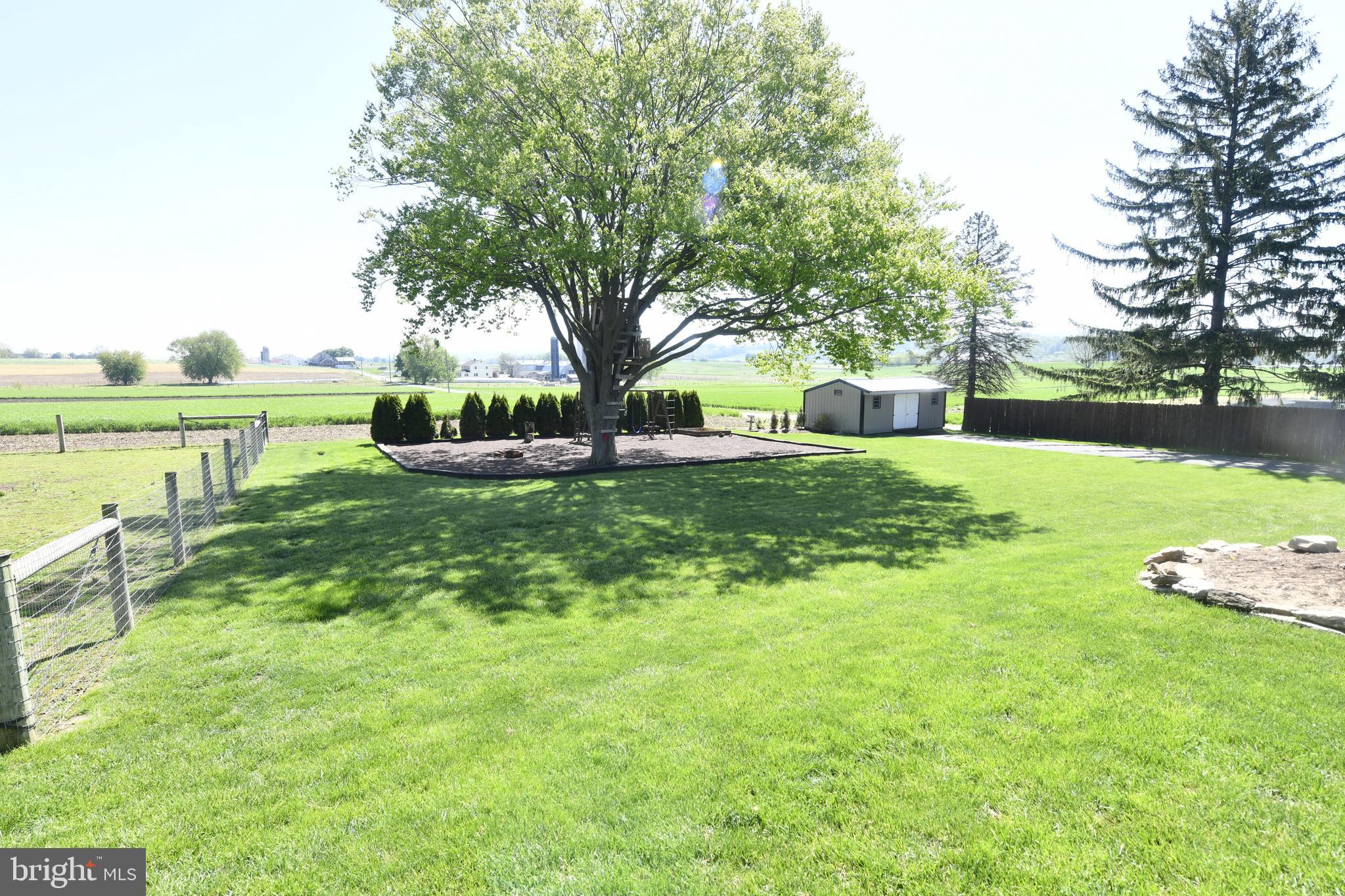 325 May Post Strasburg, PA 17579 - Photo 18 of 22 a view of a garden with lawn chairs and a big yard