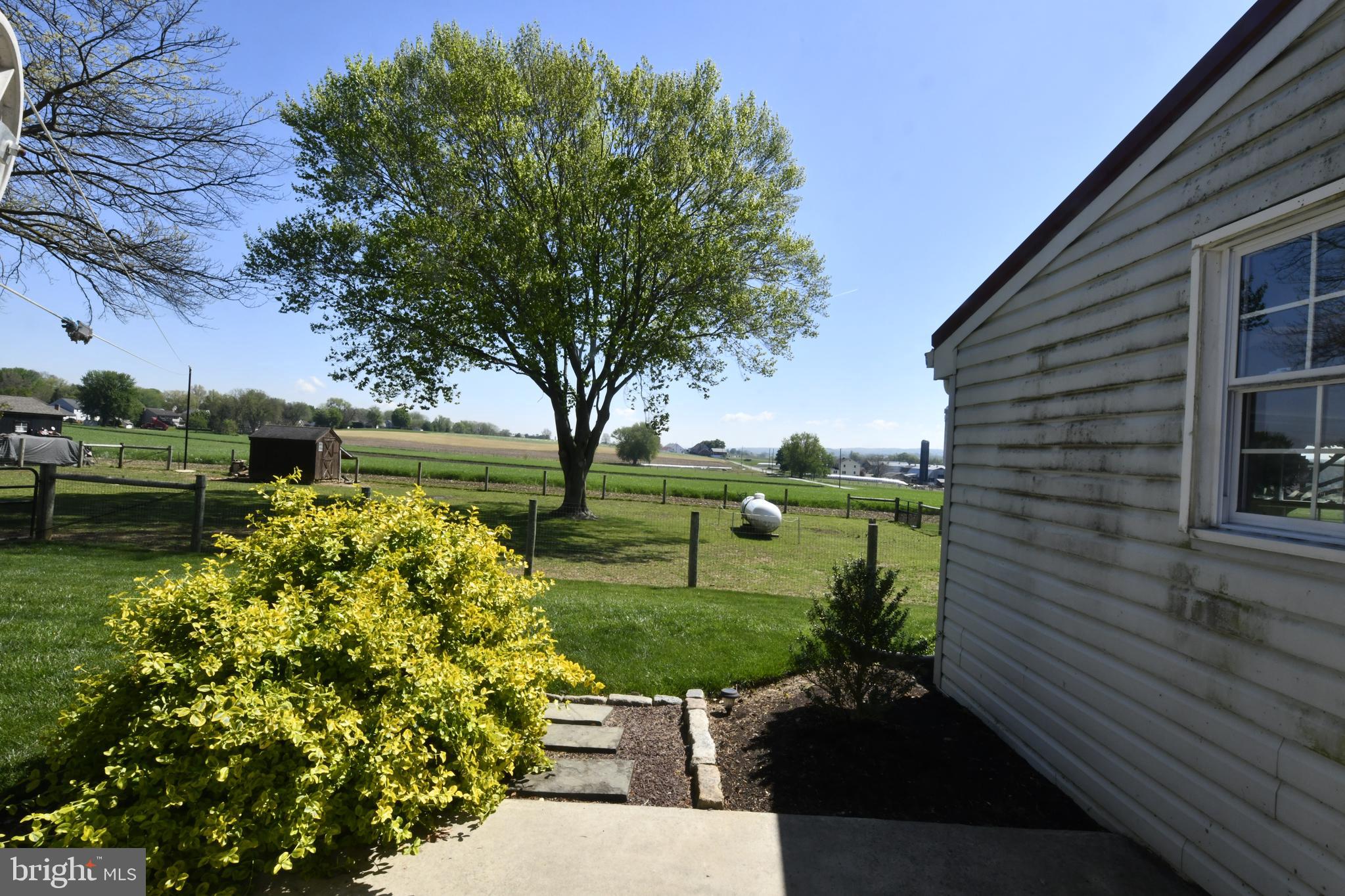 325 May Post Strasburg, PA 17579 - Photo 20 of 22 a view of a garden with a bench