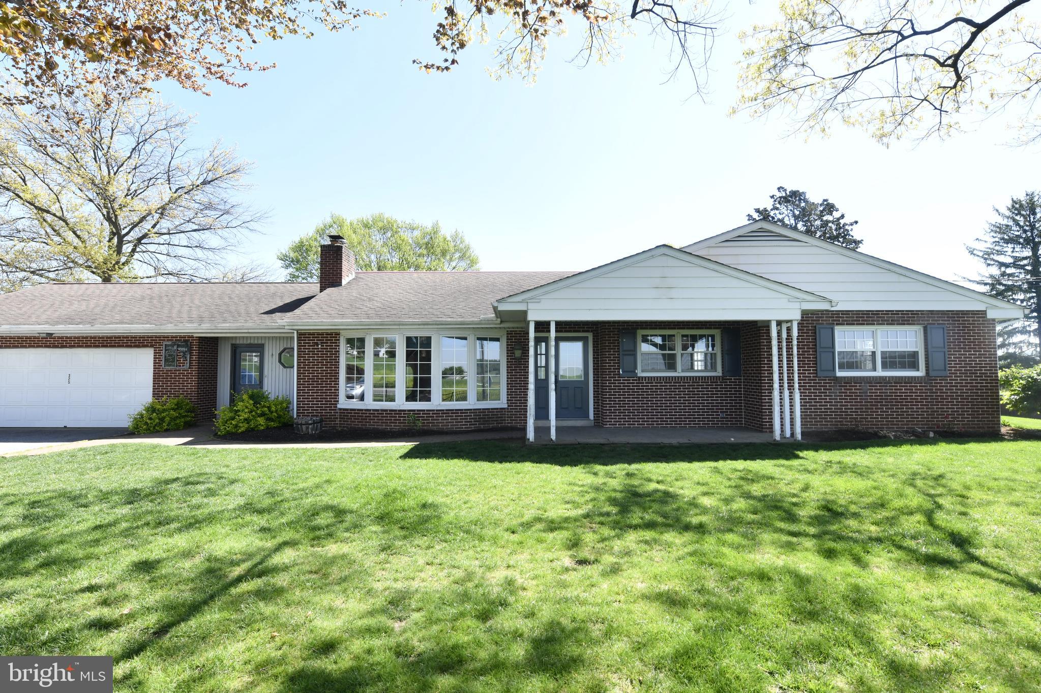 325 May Post Strasburg, PA 17579 - Photo 22 of 22 a front view of a house with yard and trees