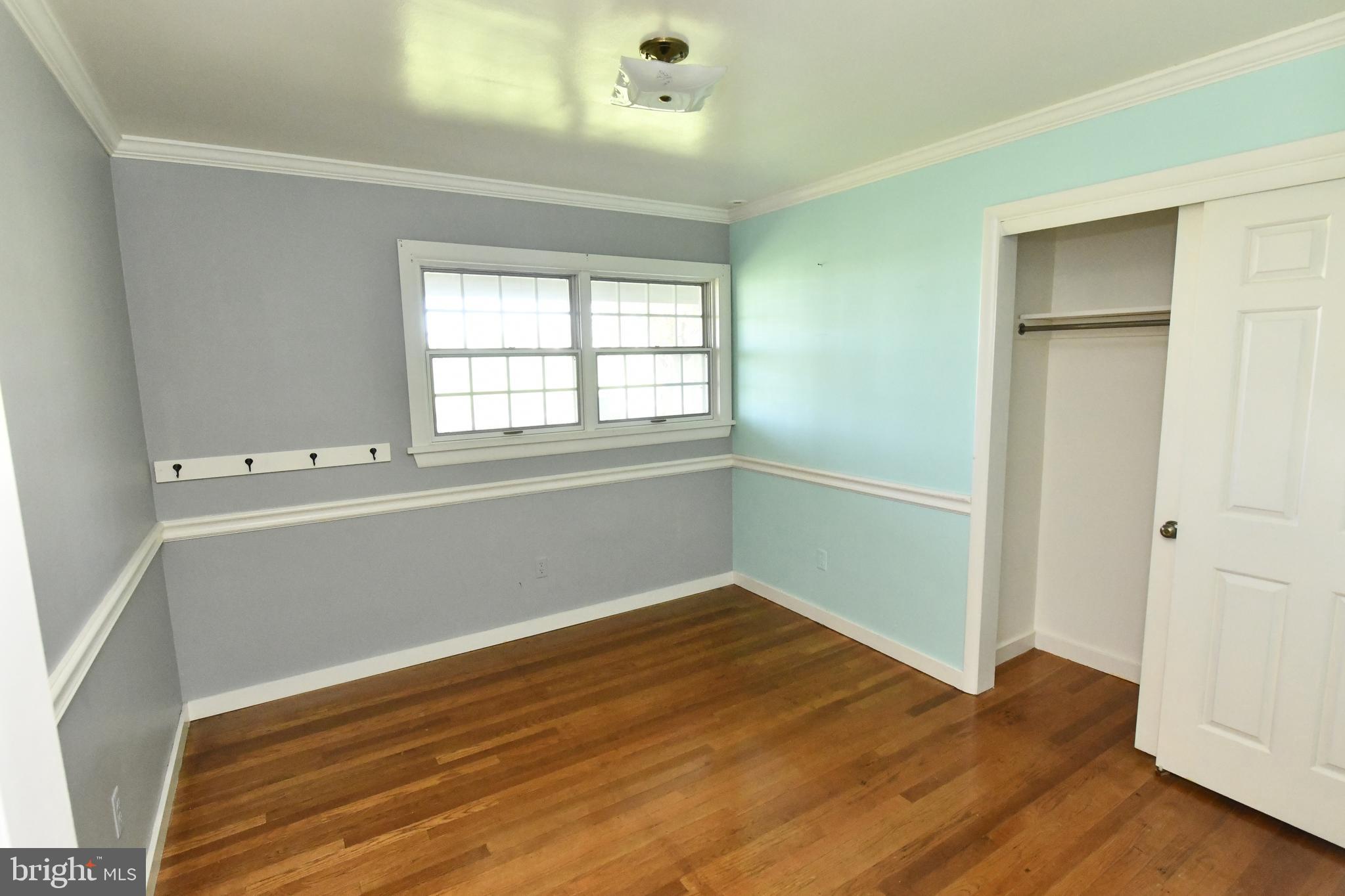 325 May Post Strasburg, PA 17579 - Photo 9 of 22 an empty room with wooden floor and windows