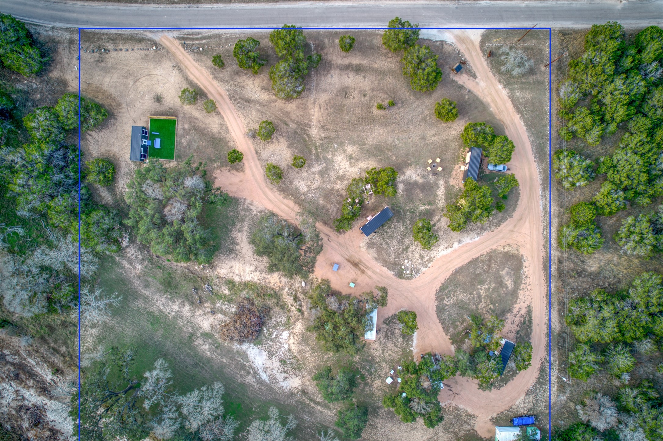 1156 Narrows Road Blanco, TX 78606 - Photo 22 of 40 Expansive aerial view showcasing a large parcel with multiple structures and extensive natural landscaping
