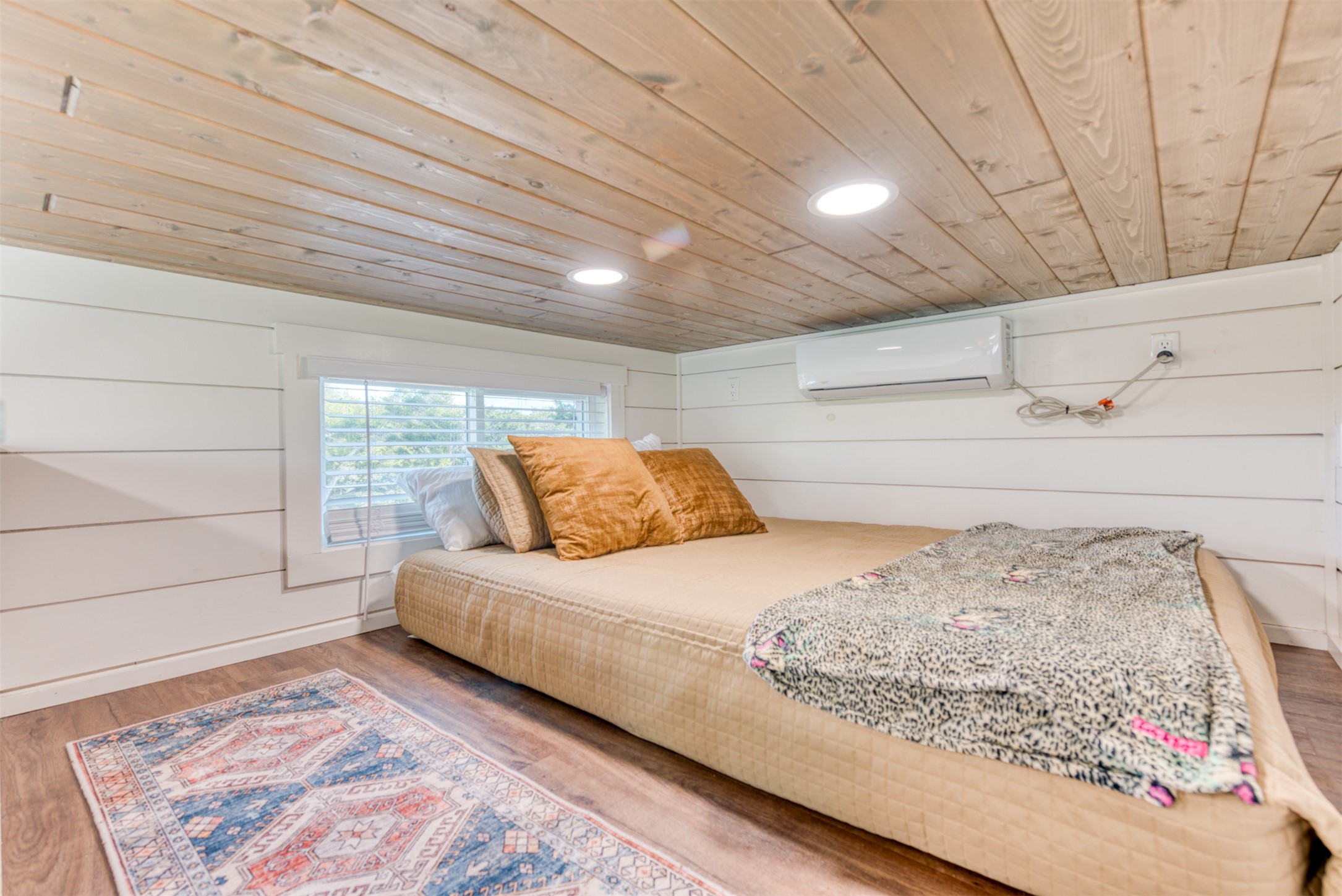 1156 Narrows Road Blanco, TX 78606 - Photo 29 of 40 Wood-finish plank ceiling and flooring complement white shiplap walls