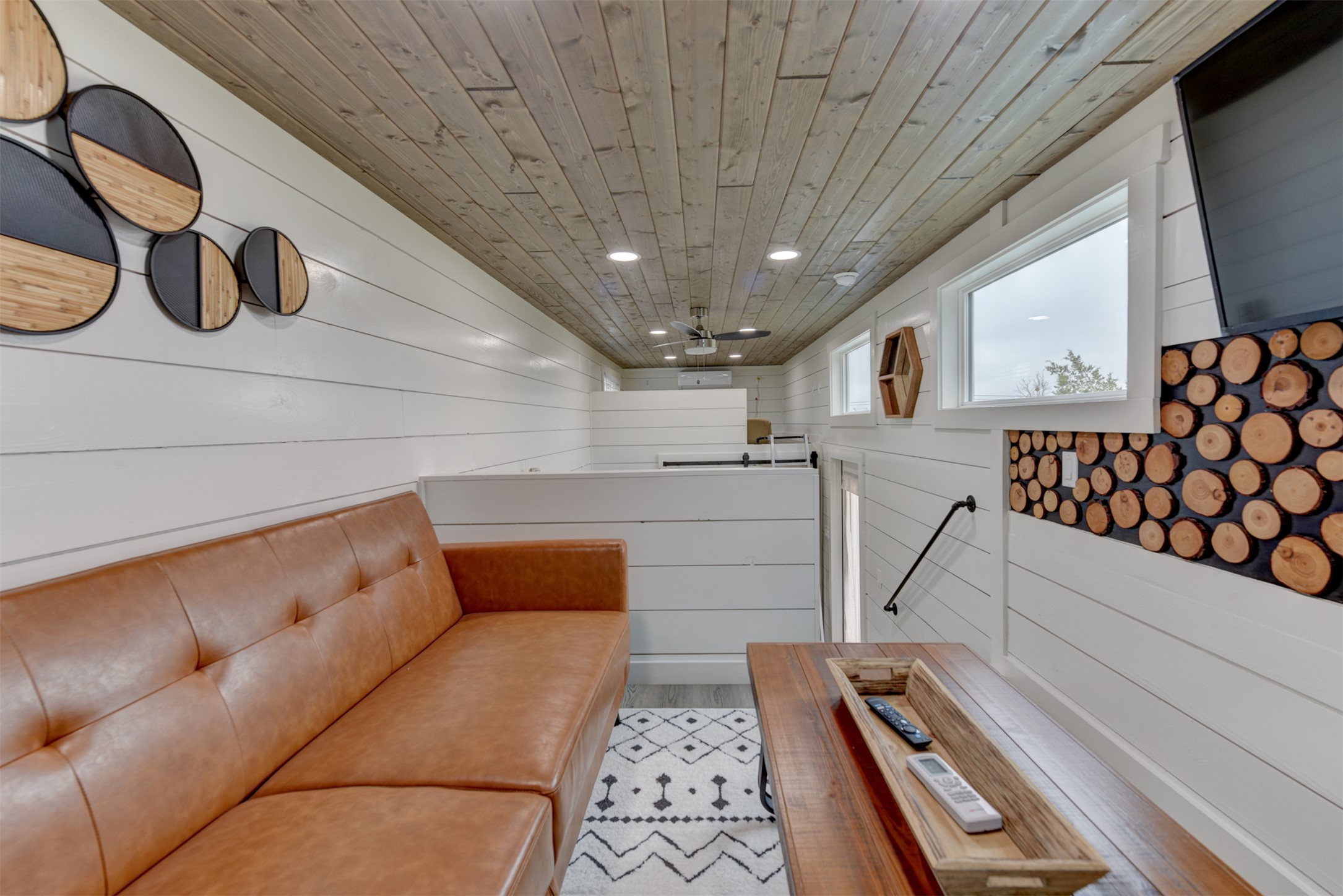 1156 Narrows Road Blanco, TX 78606 - Photo 8 of 40 Interior featuring white shiplap walls, wood-finish plank ceiling, recessed lighting, and horizontal windows