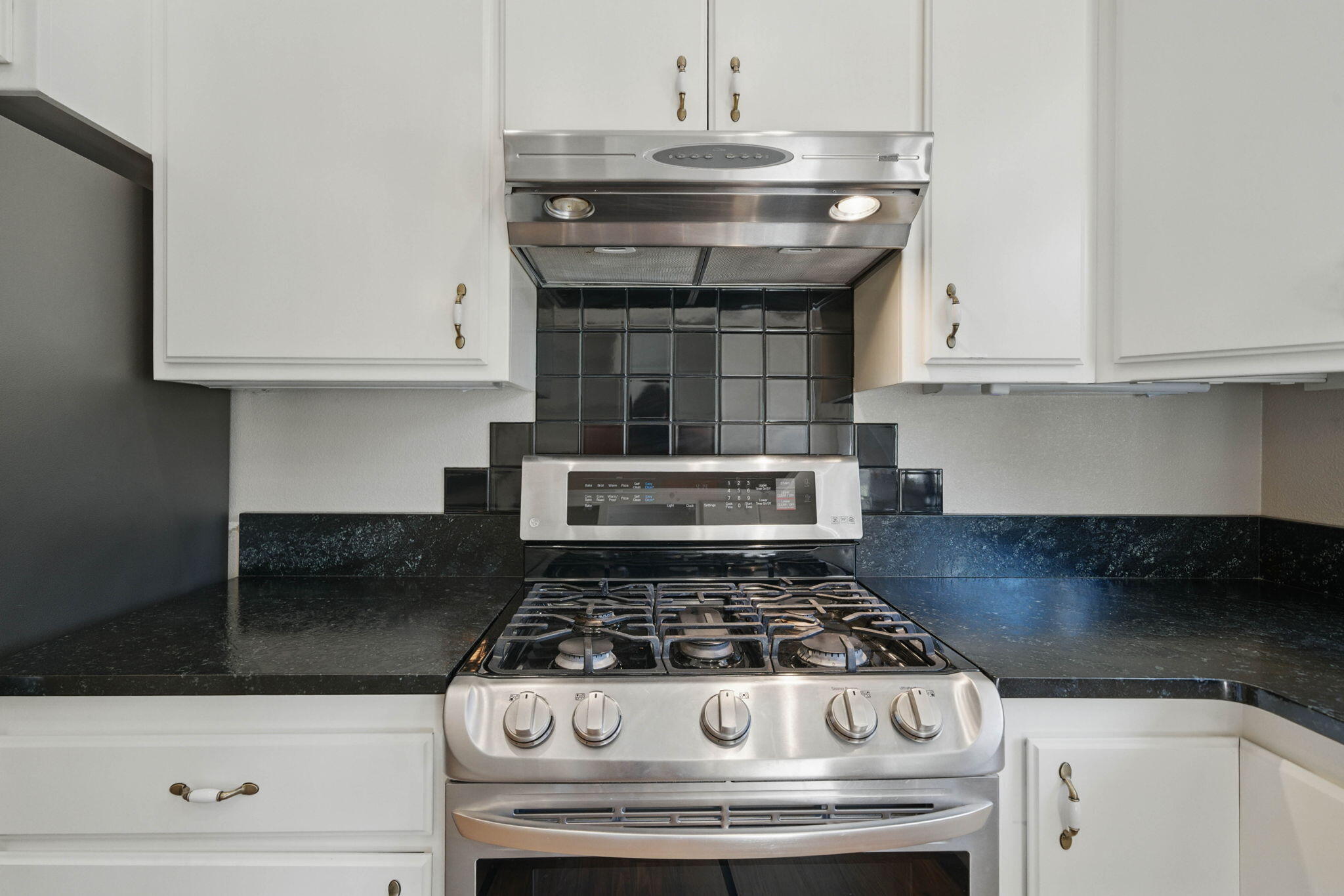 15399 Star Flower Road Oak Run, CA 96069 - Photo 13 of 44 a stove top oven sitting inside of a kitchen