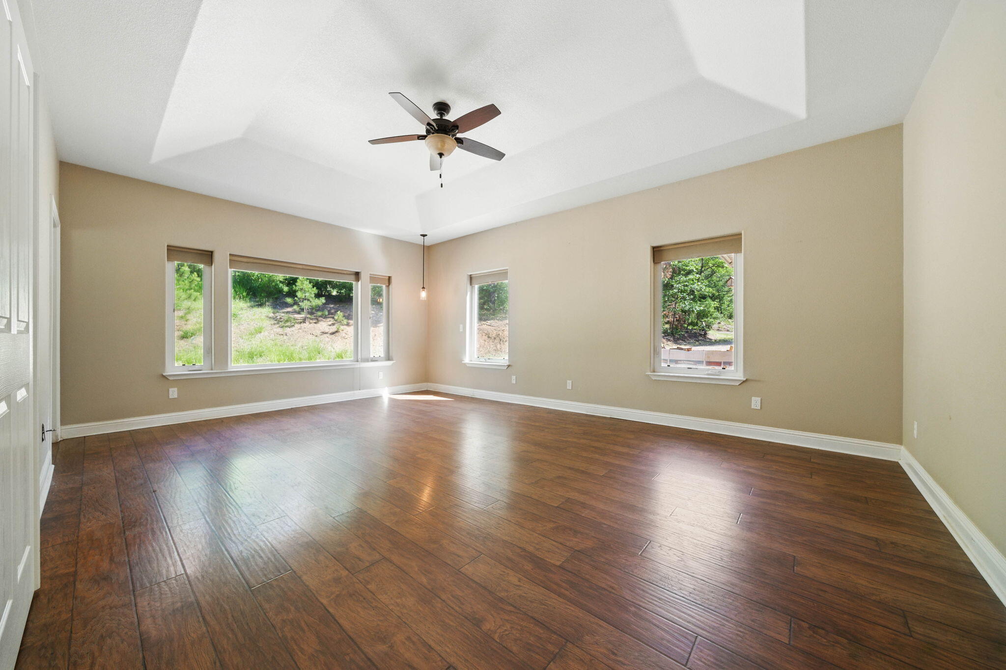 15399 Star Flower Road Oak Run, CA 96069 - Photo 16 of 44 a view of an empty room with wooden floor and a window