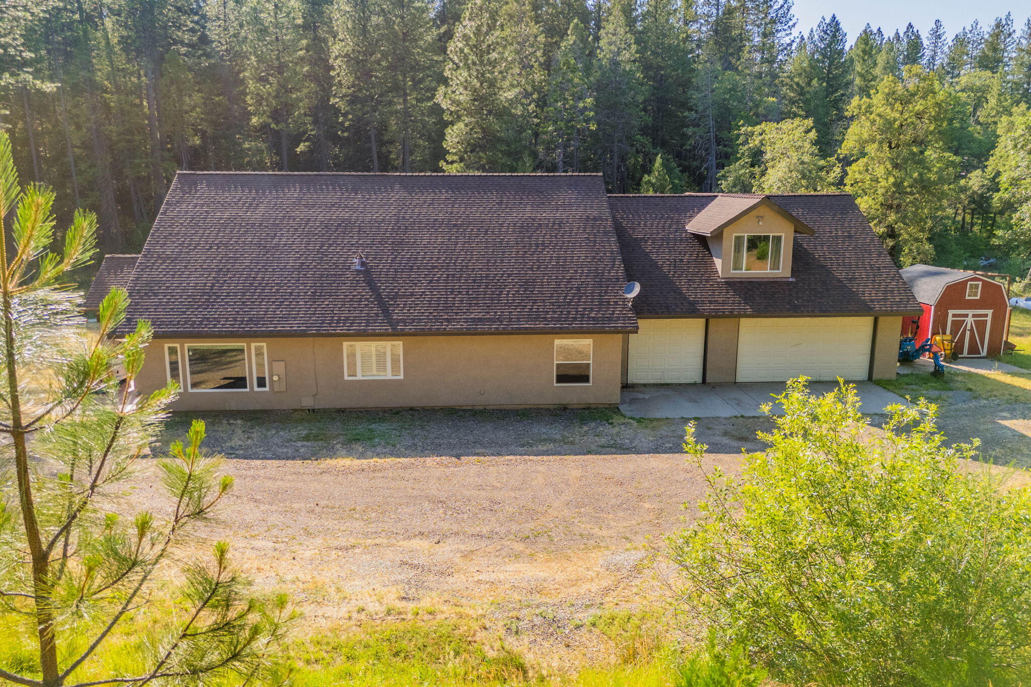 15399 Star Flower Road Oak Run, CA 96069 - Photo 2 of 44 a front view of a house with a yard